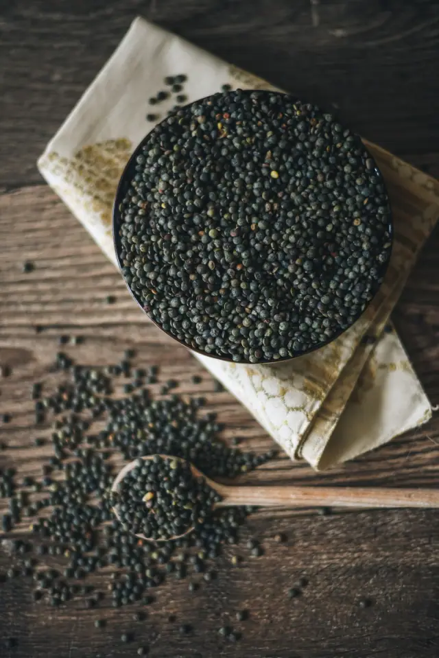 A bowl filled with dry lentils