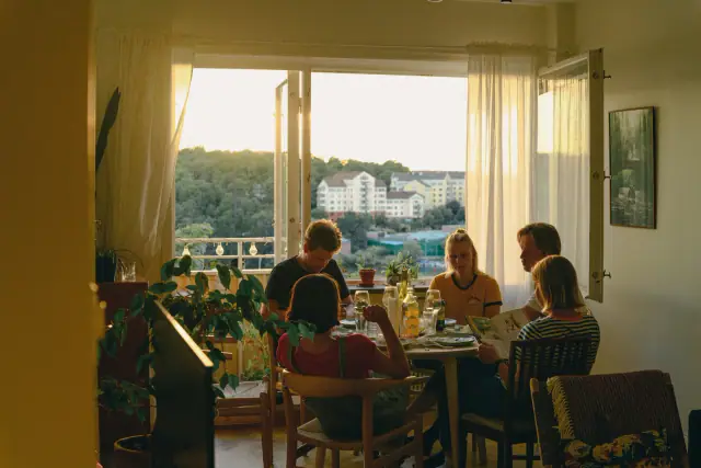 Friends seated together around a dinner table