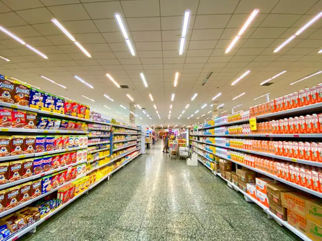 A grocery aisle with shelves of packaged foods