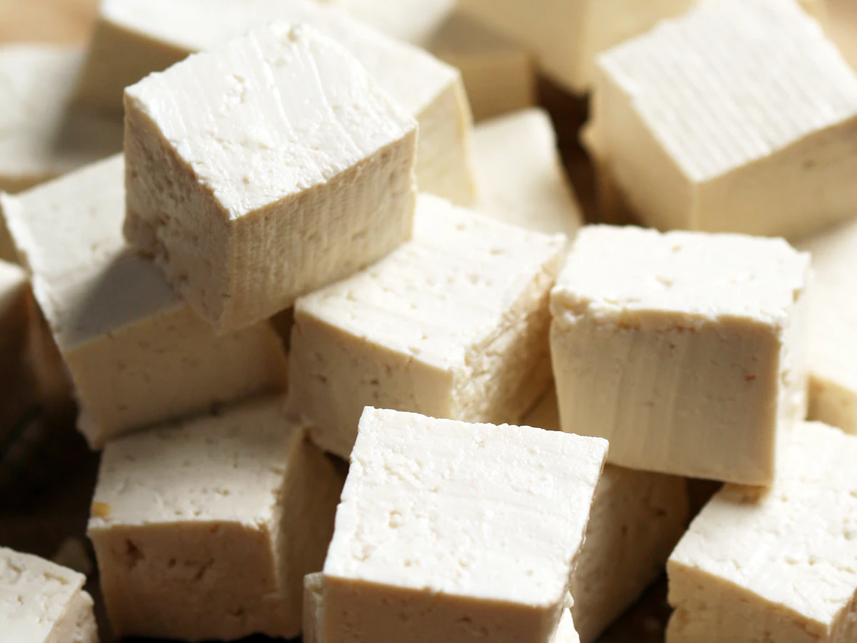 Tofu cubes on a cutting board